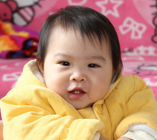 young girl in yellow jacket