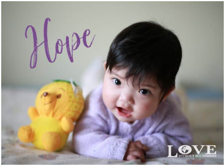 baby girl with toy, Hope