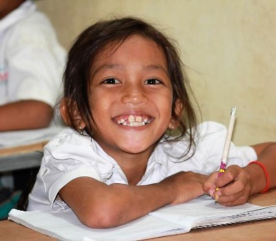 smiling girl doing school work