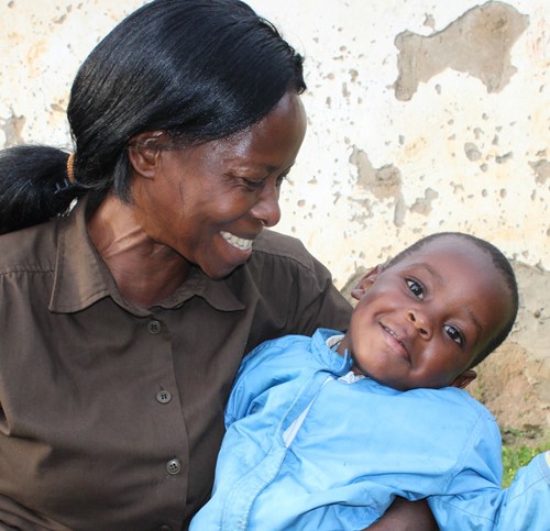 foster mother with smiling child