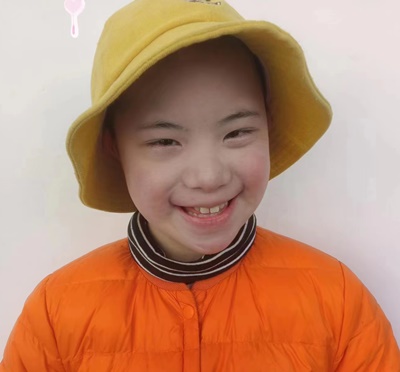 young girl in China wearing a hat