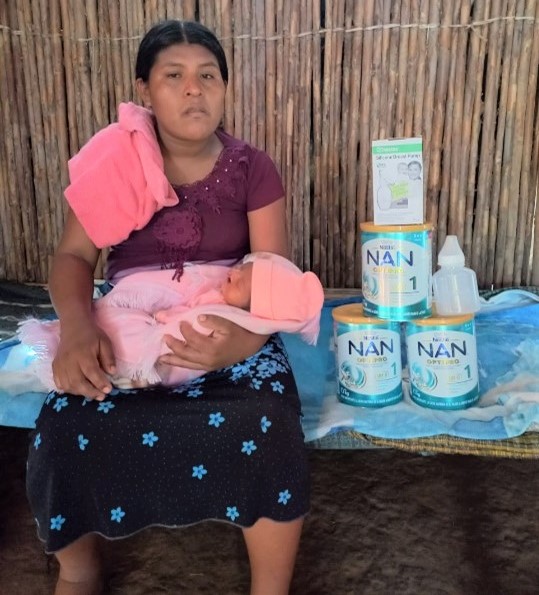 Woman with baby and formula