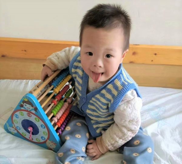 Boy in blue with abacus