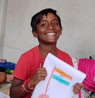student in India holding drawing
