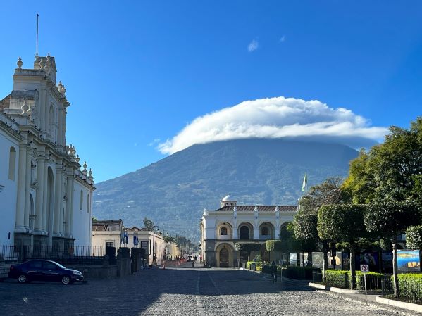 Antigua, Guatemala with blue sky and cloud over the volcano