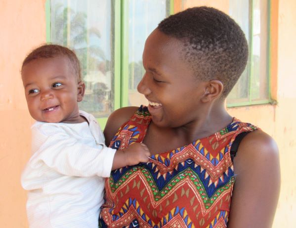 Ugandan foster sisters smiling