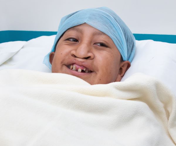 Boy with cleft lip preparing for surgery