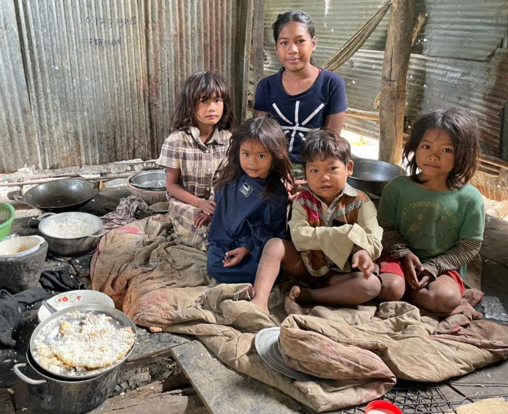 5 Cambodian Children inside with food