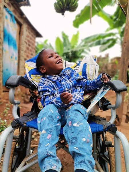 young boy in wheelchair in Uganda