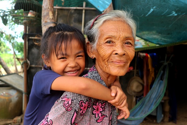 young girl in Cambodia with grandmother