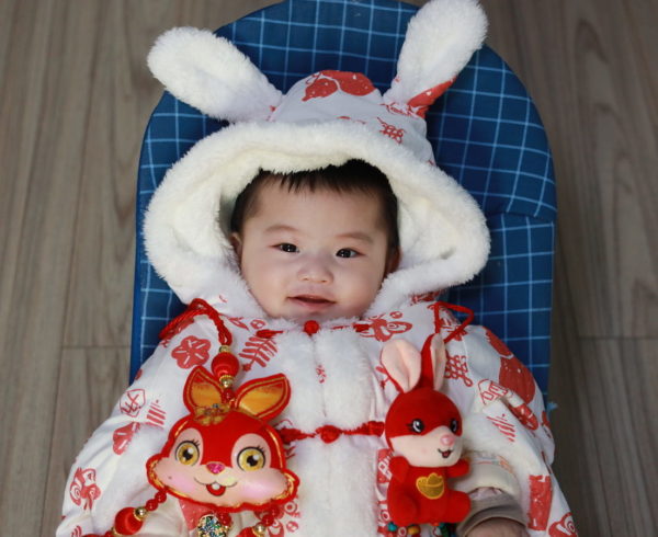 Baby boy dressed in a Year of the Rabbit costume