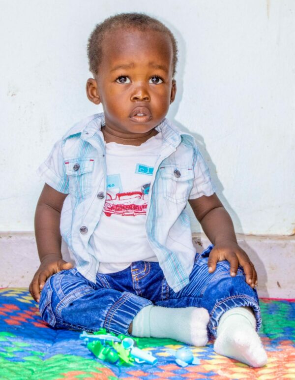 Baby boy in blue jeans waiting for heart surgery