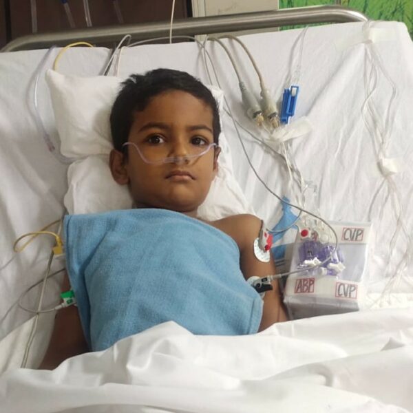 Indian boy in hospital bed