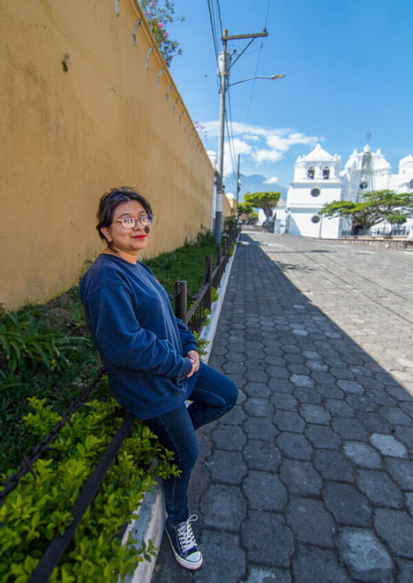 Teen girl in Guatemala leaning on wall