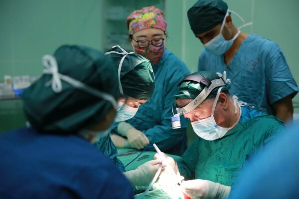 Surgeons and medical team performing a cleft surgery operation