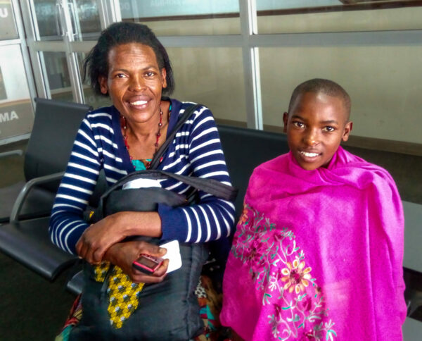 Ugandan mother and daughter preparing to travel