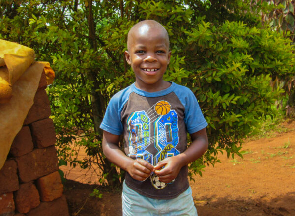Ugandan boy in a basketball shirt