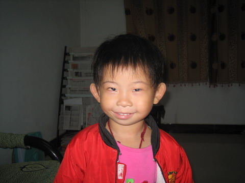 Little girl in China wearing a red jacket