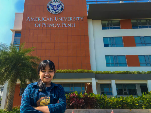 Young woman in front of American University of Phnom Penh