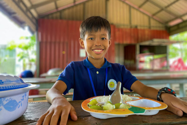 Boy from Love Without Boundaries' Believe In Me school in Cambodia eats a hot lunch