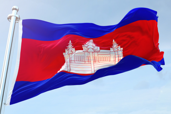 Cambodian flag flying on a blue sky background