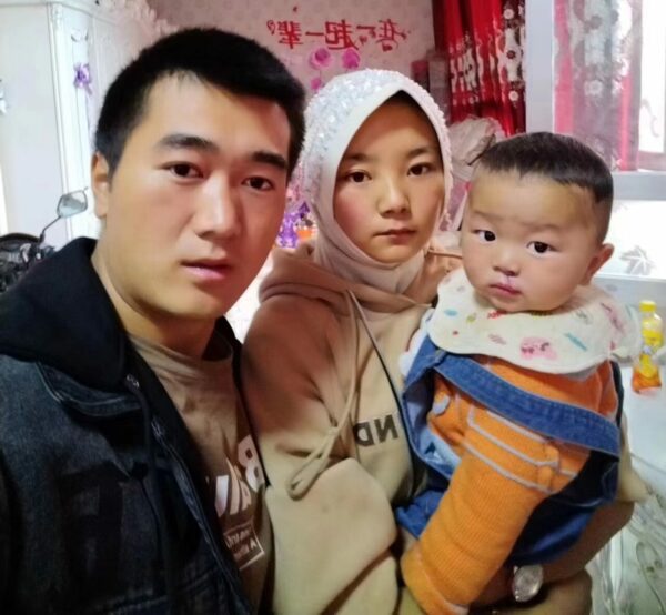Baby boy with repaired cleft lip at home with his parents in China