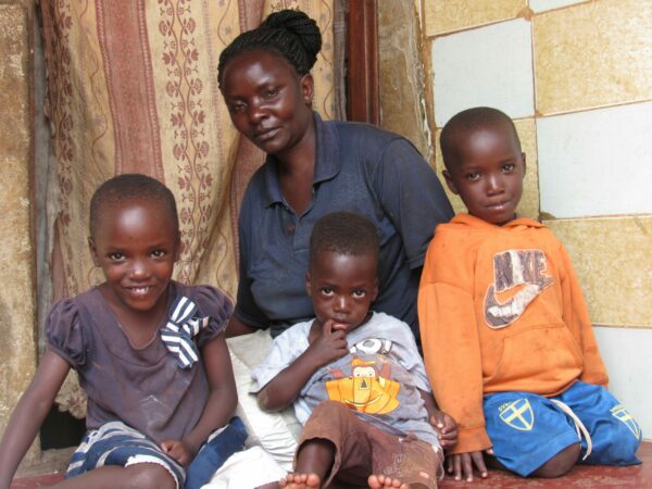 Three children with foster mom for 20 Years of Hope blog