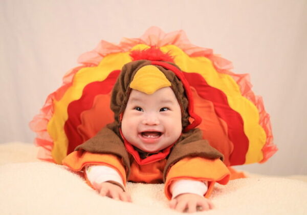 Baby boy dressed in a turkey costume for 20 Years of Hope blog