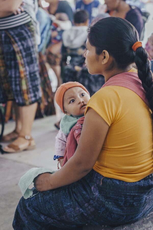 Baby and mom waiting for cleft surgery in Guatemala