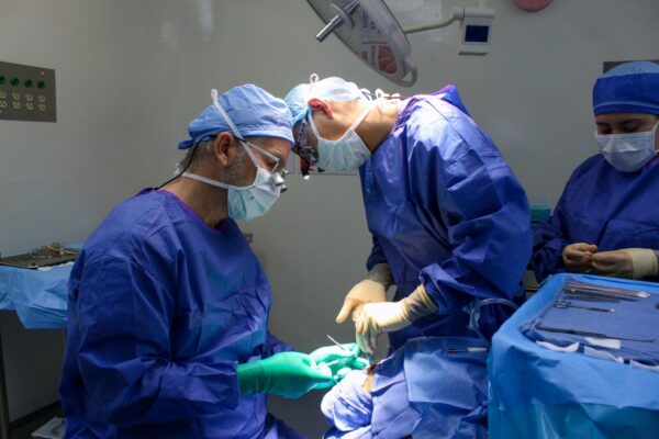 Surgeons performing cleft repair surgery