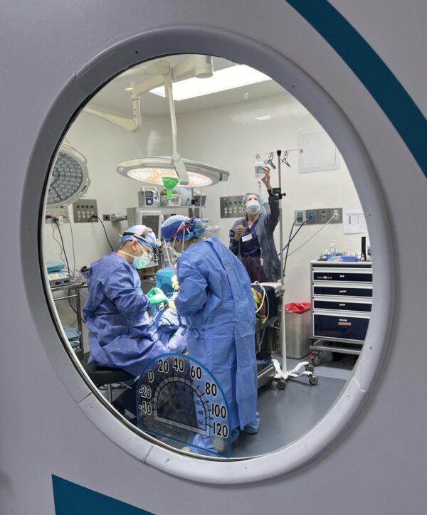 Doctors in an operating room performing cleft surgery for a cleft surgery trip to Guatemala
