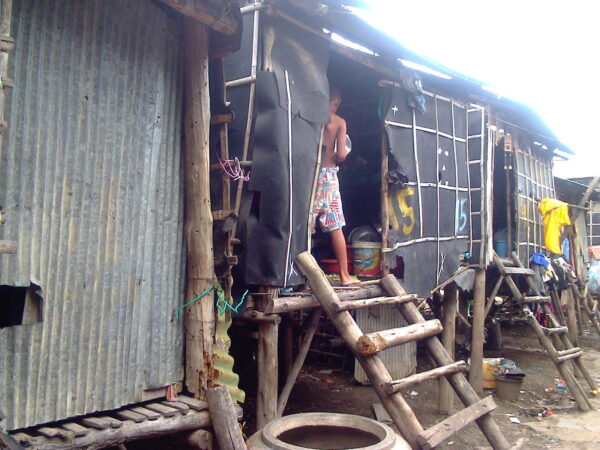 Row of metal shacks in rural Cambodia