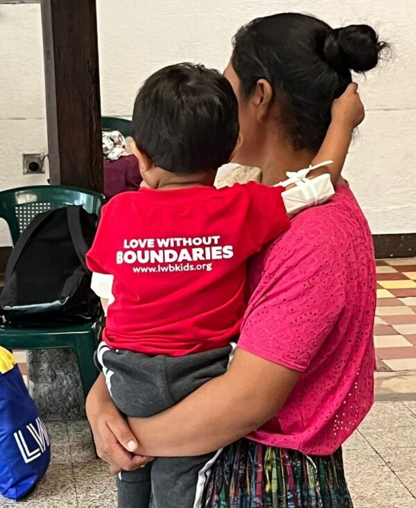 Mom and child wearing Love Without Boundaries t-shirt in Guatemala