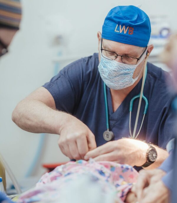 Surgeon performing cleft repair surgery