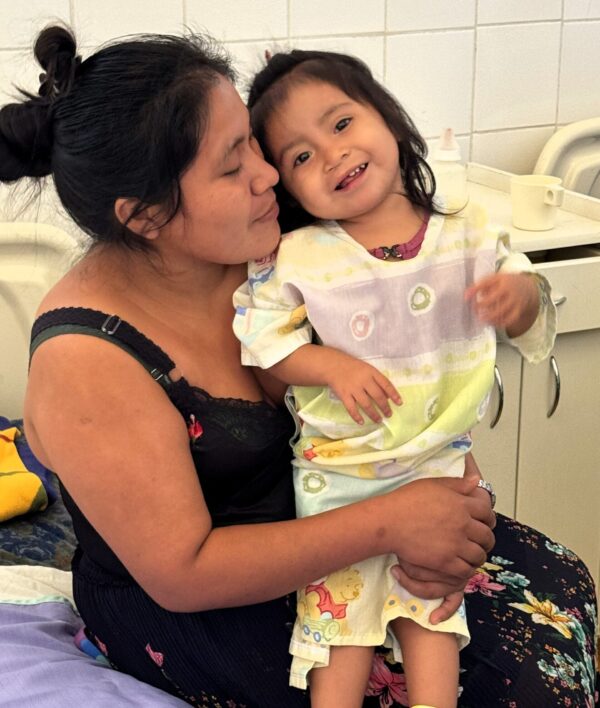 Mom and toddler girl in hospital after cleft palate surgery